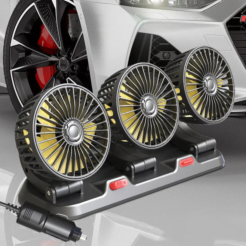 Three-head adjustable 12V car cooling fan with USB and cigarette lighter plugs on a dashboard.