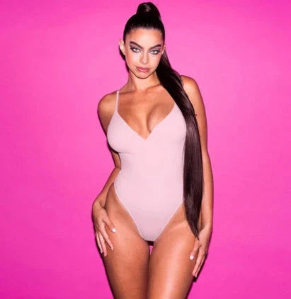 A stylish, backless one-piece swimsuit in a variety of vibrant colors for women's summer fashion.
