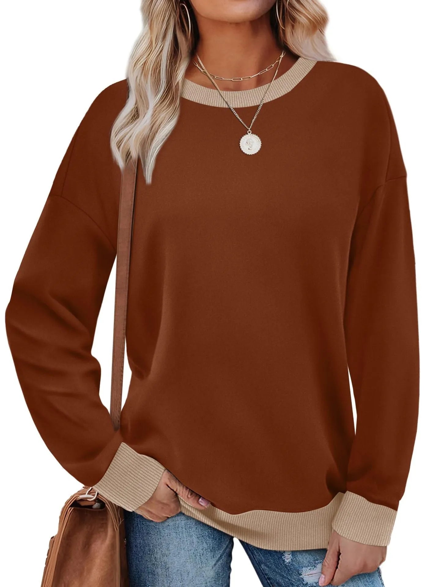 Loose fit striped long sleeve top for women on a hanger, shown in apricot colour.