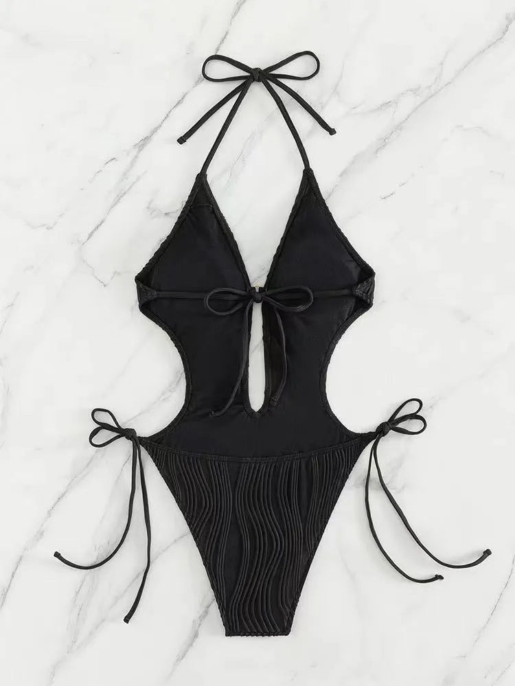 Women's black lace-up triangle bikini swimsuit made from polyester fabric