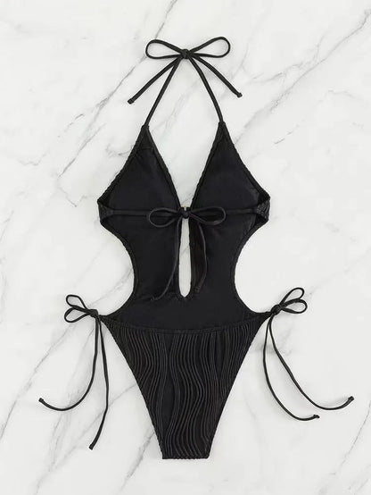 Women's black lace-up triangle bikini swimsuit made from polyester fabric