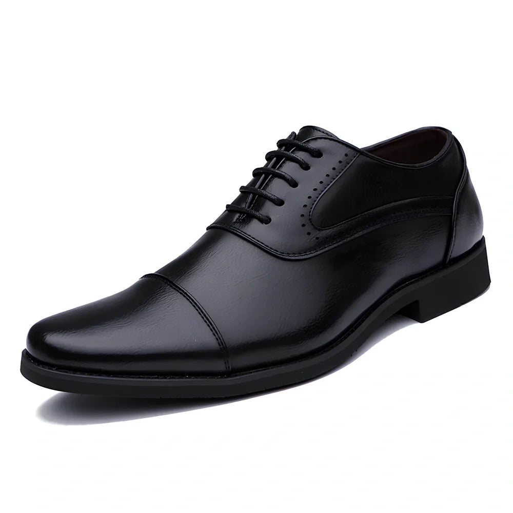 Men's black casual leather shoes with low-top design and visible sewing lines on PU leather upper