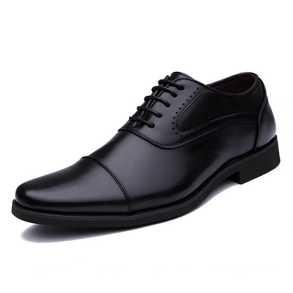 Men's black casual leather shoes with low-top design and visible sewing lines on PU leather upper