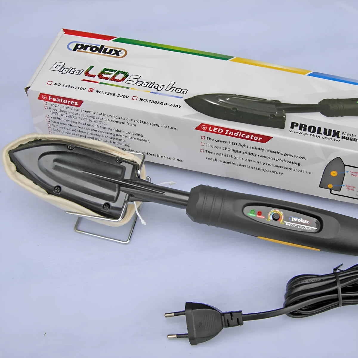 Electronic temperature control iron for styling wigs and hairpieces with metal barrel and PTFE soleplate.