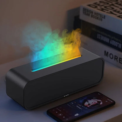 Black and white USB aroma diffuser with remote control showing flame dynamic and colour-changing light effects.