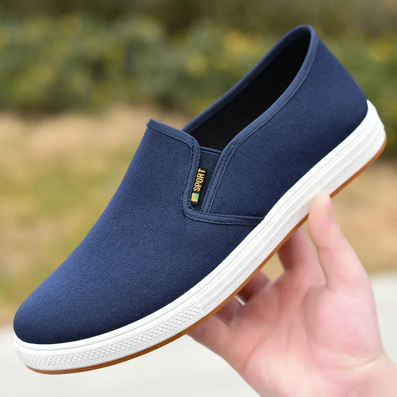 Men's cloth shoes slip-on canvas low-top casual footwear with injection moulded composite sole and round toe design, available in black and blue colour options, sizes 39 to 44 with shallow cut depth of less than 7cm