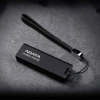 Black waterproof plastic USB flash drive for car mounting, showing compact size.