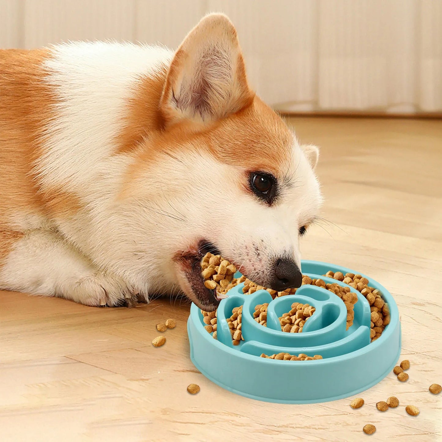Blue silicone slow feeder dog bowl with raised labyrinth puzzle pattern for dogs.