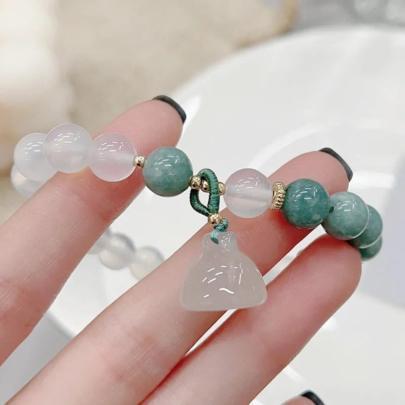 Women's retro Chinese style agate lotus seedpod bracelet showing natural stone patterns
