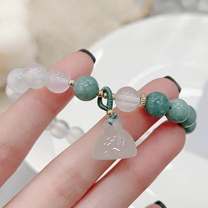 Women's retro Chinese style agate lotus seedpod bracelet showing natural stone patterns