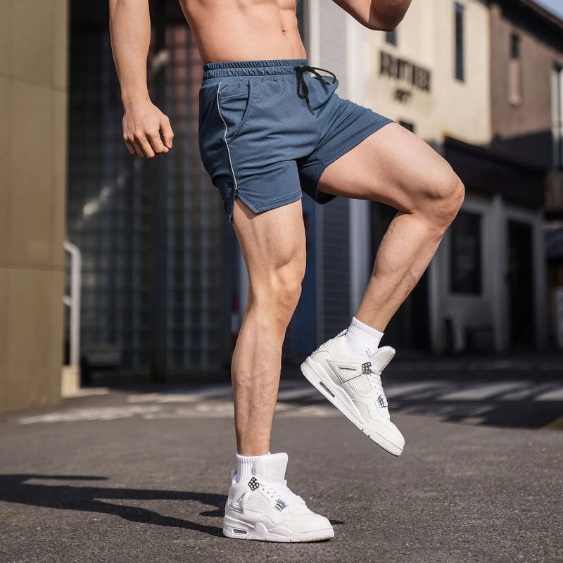 Men's fitness sports casual shorts in stretch polyester fabric for gym workouts, running, and leisure wear, available in black, grey, navy blue, and red colours and a straight-leg cut in sizes M to 3XL.