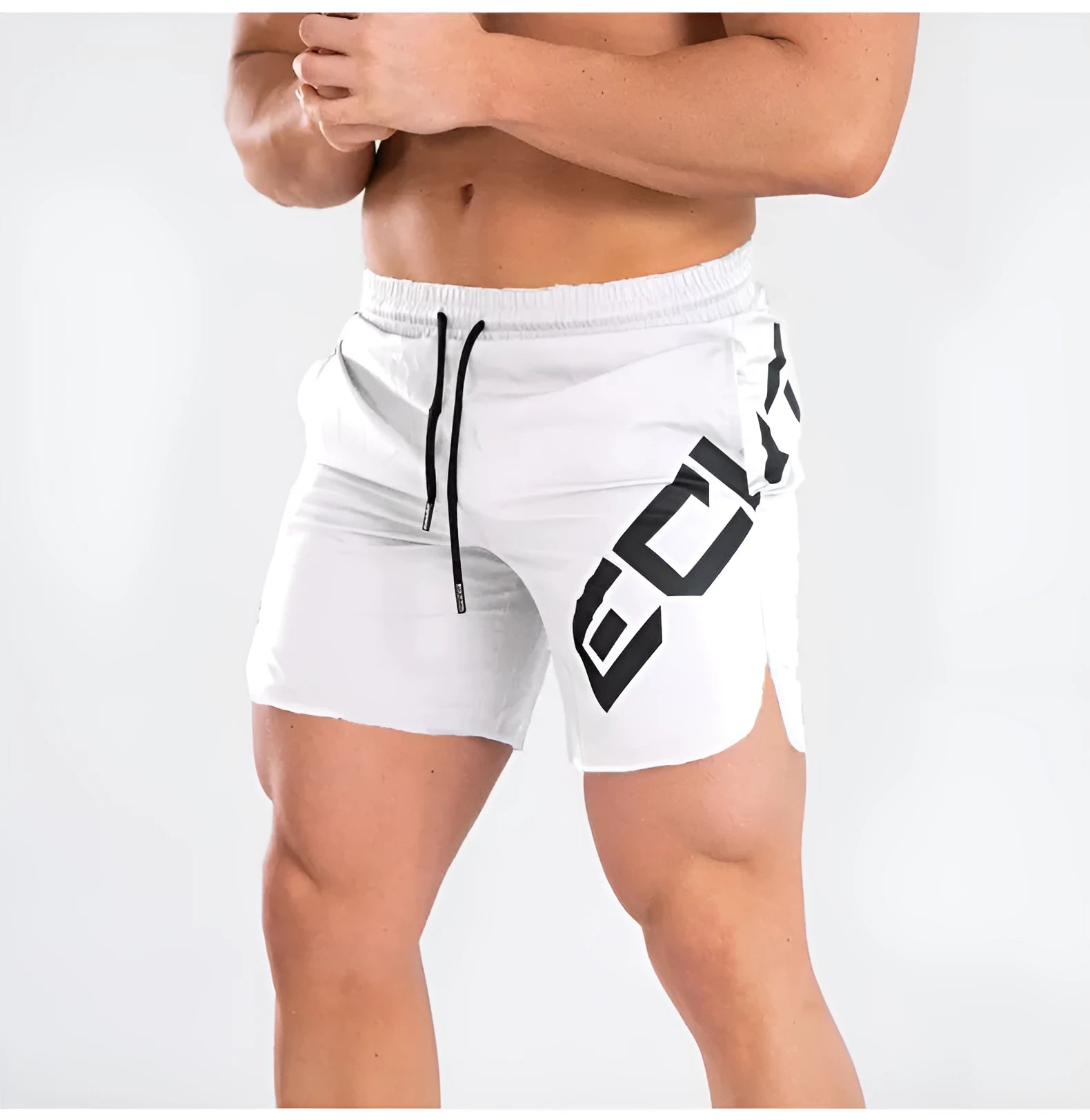 Man wearing black knee-length nylon training shorts with an elastic mid waist.