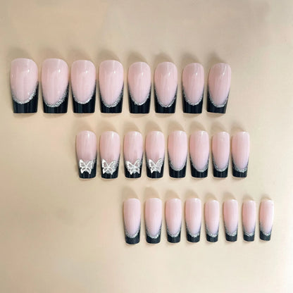 Black French style butterfly nail armour set with glitter decoration on medium-length nails