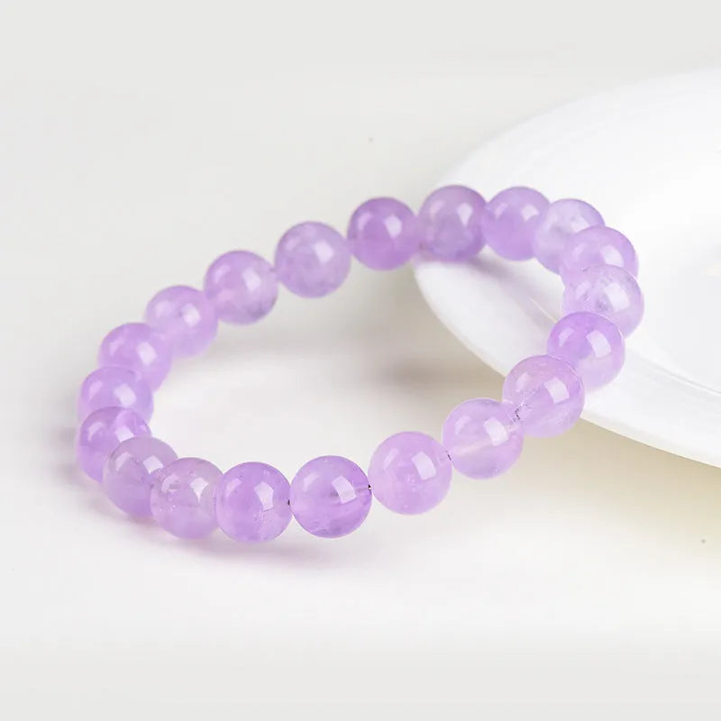 Lavender amethyst bracelet with water ripple design on beads, showing cream body and transparent colour options