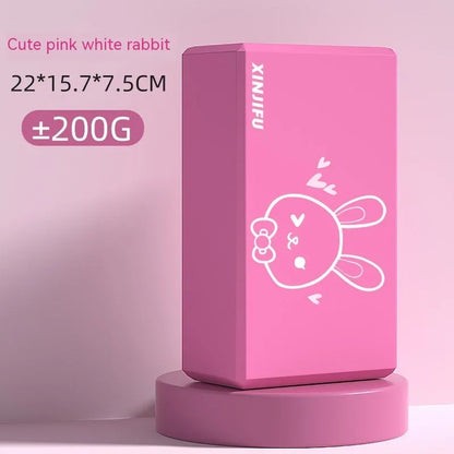 High-density EVA foam yoga block in violet colour, shown next to a pink block with a cartoon bunny print.