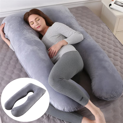 Light blue U-shaped ice silk maternity pillow for pregnancy support on a bed
