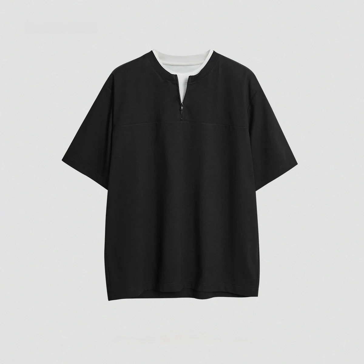 Solid colour loose fit cotton blend pullover top with patchwork collage detailing on a model.
