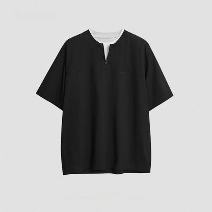 Solid colour loose fit cotton blend pullover top with patchwork collage detailing on a model.