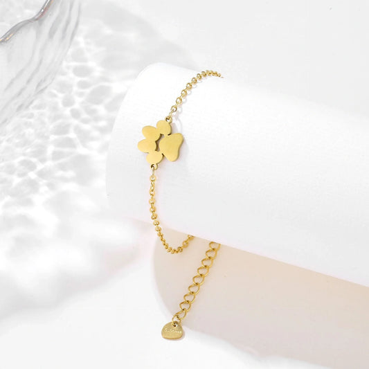 Stainless steel bracelet with a polished dog paw design, a stylish accessory for pet lovers