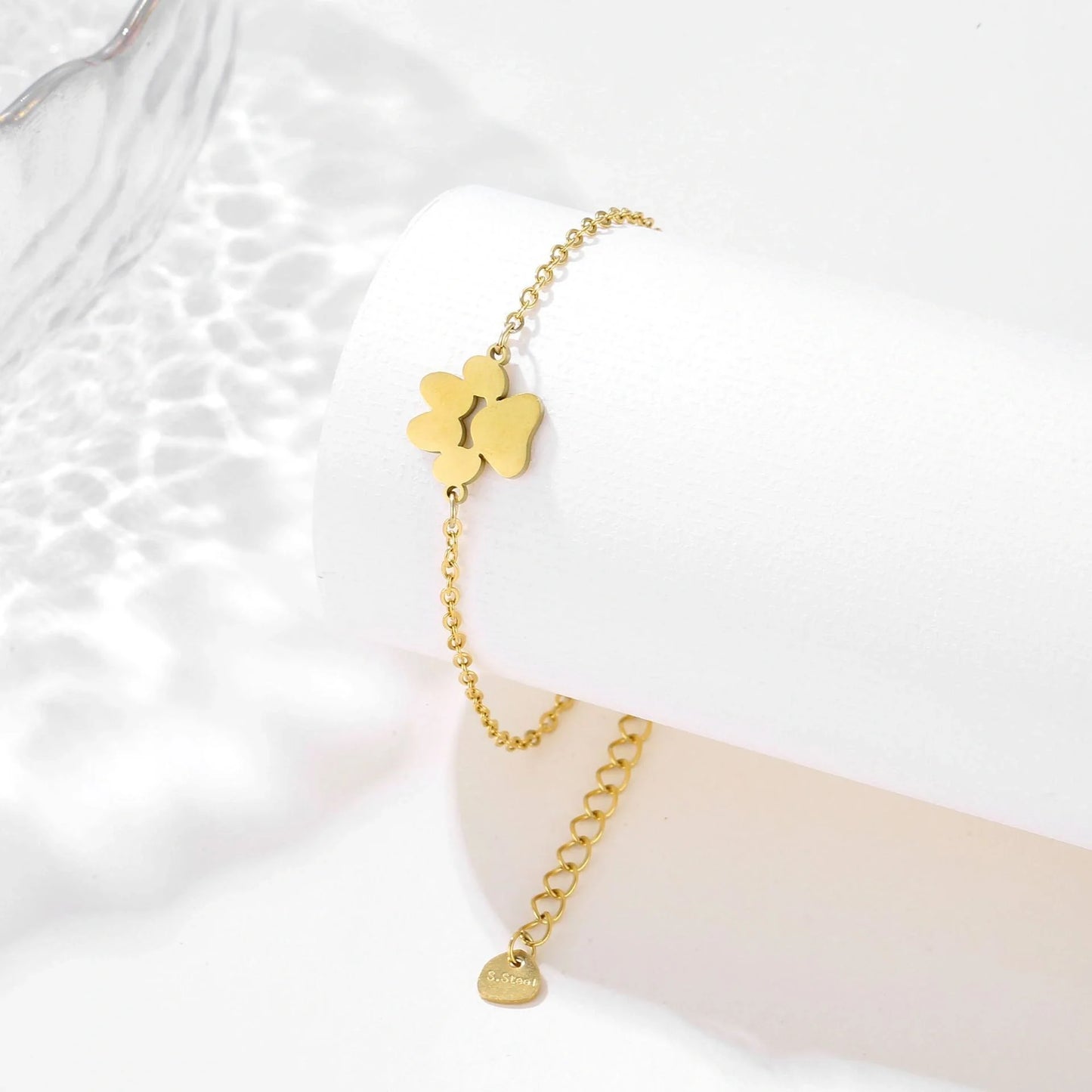 Stainless steel bracelet with a polished dog paw design, a stylish accessory for pet lovers