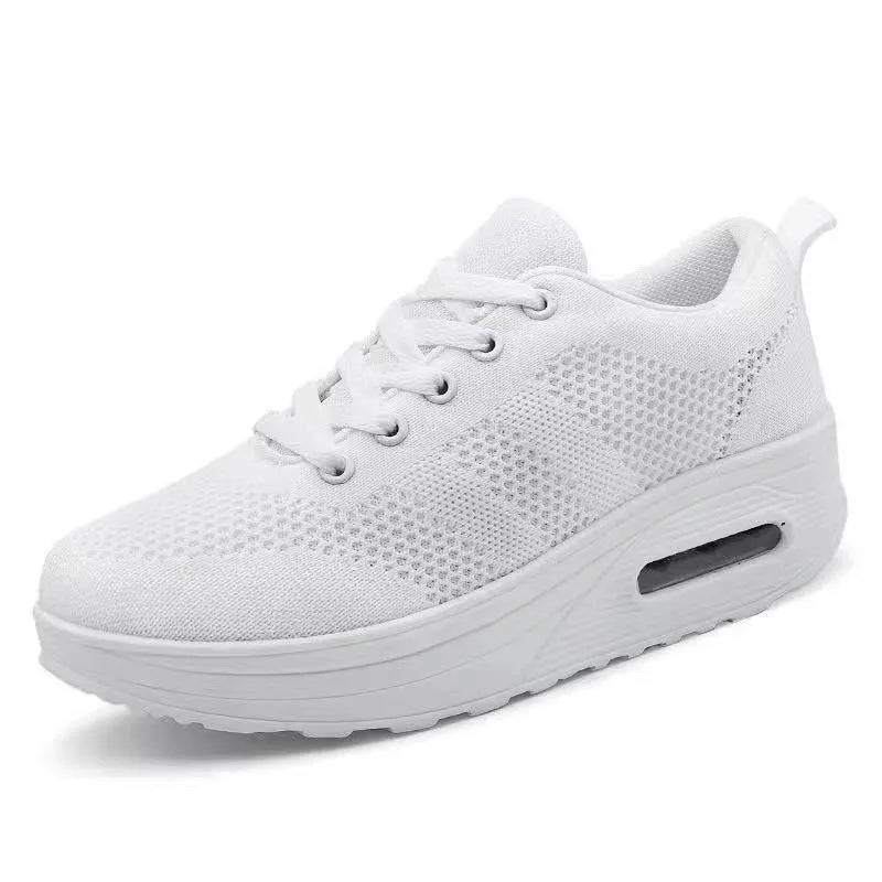 Women's solid colour platform casual shoes in flyknit with a vulcanised sole and T-shaped ribbon detail.