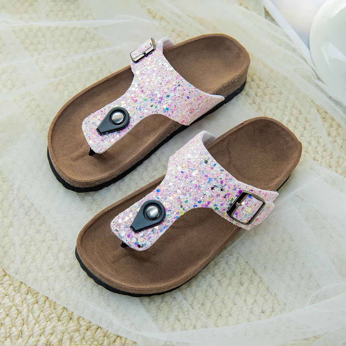 Cork flip-flops with frosted PVC sole and artificial leather upper in pink, silver, and gold colours
