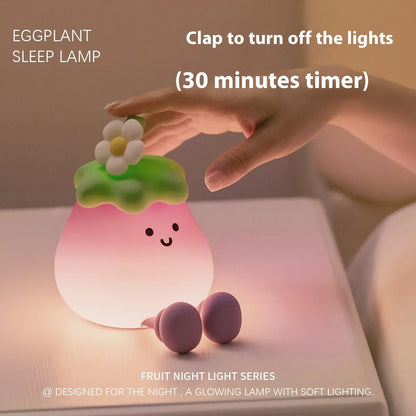 Cartoon eggplant-shaped night light with soft yellow glow measuring 100mm diameter