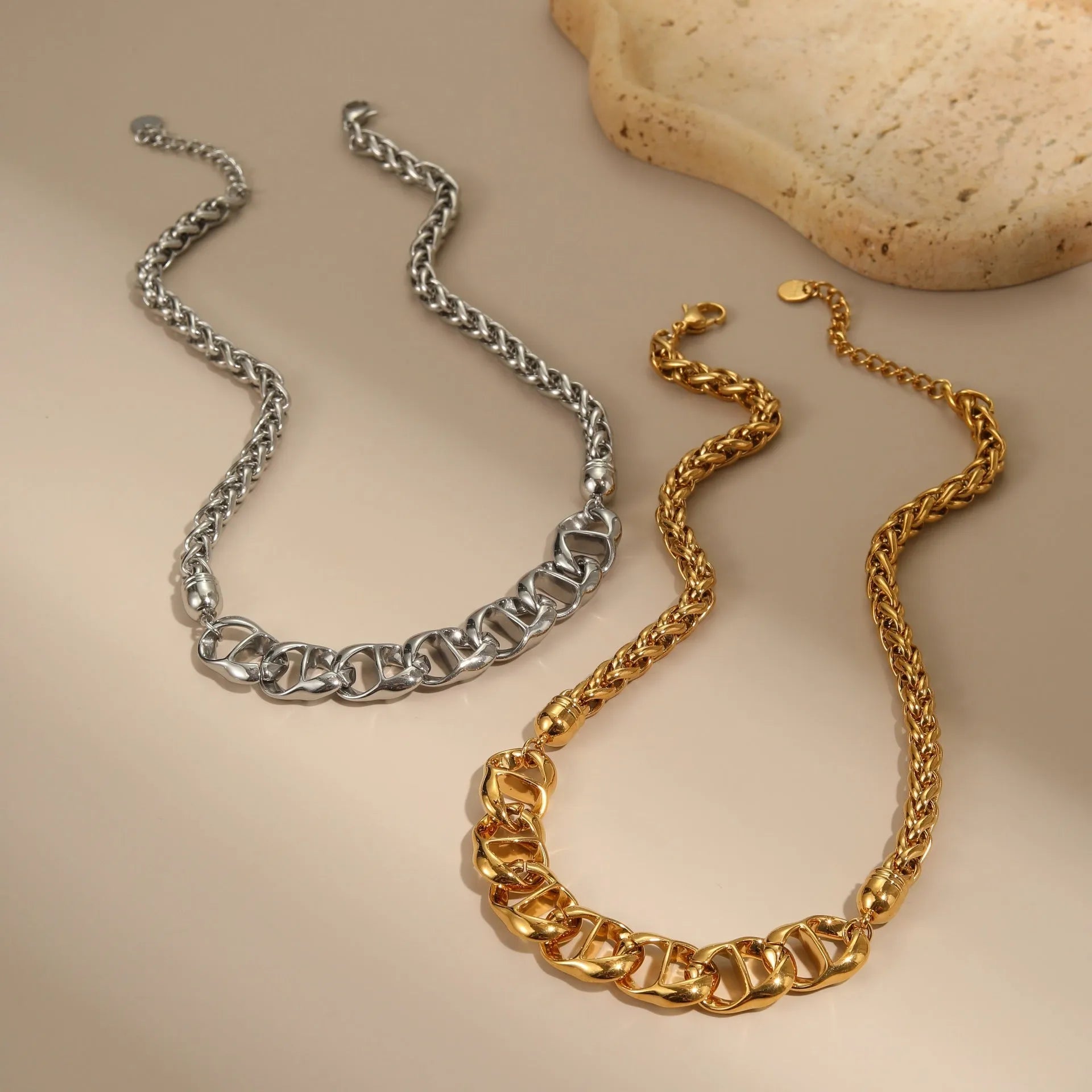 Gold plated stainless steel necklace with geometric pendant for women, shown in two colour options.