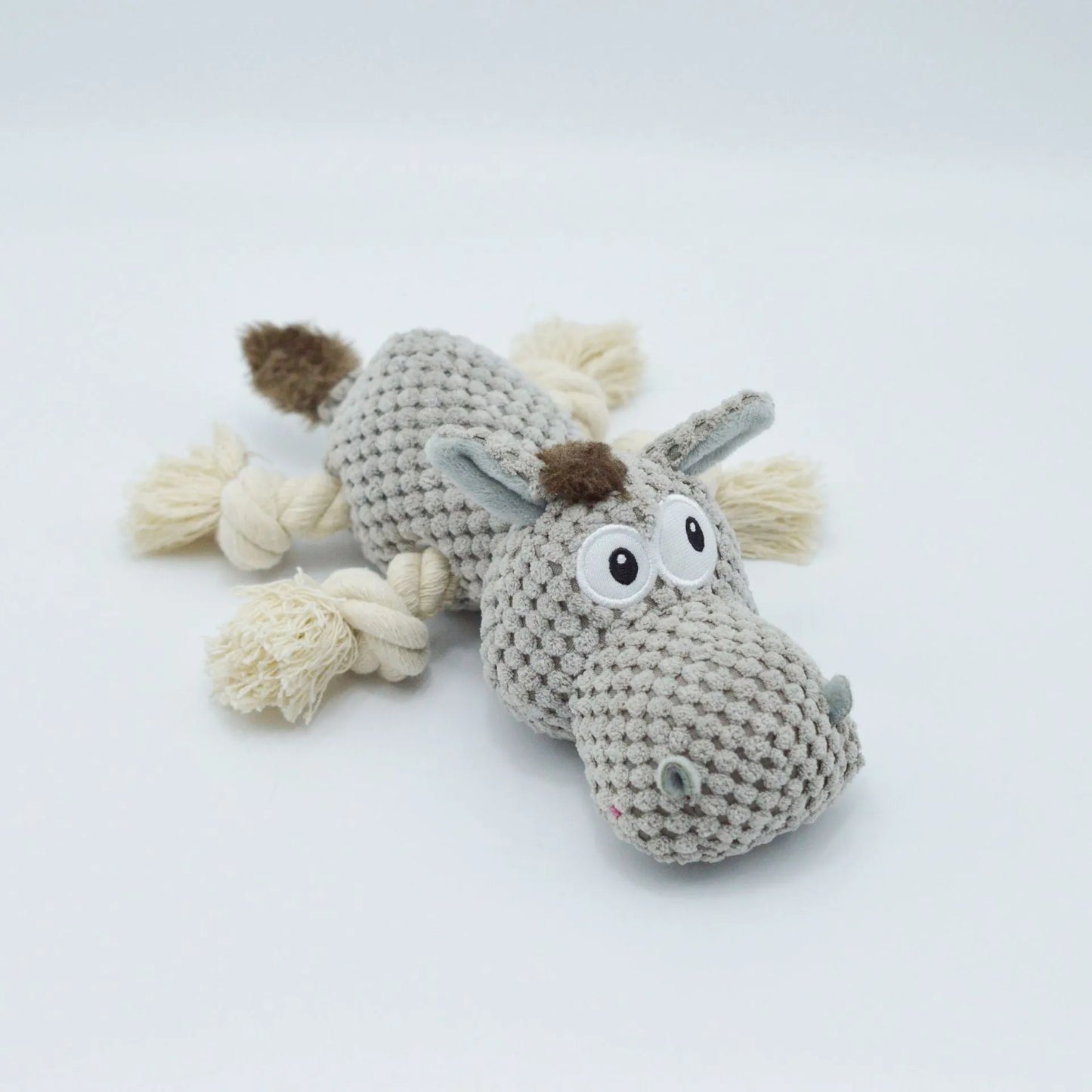 Grey donkey-shaped plush dog toy with cloth velvet material showing creaking sound feature