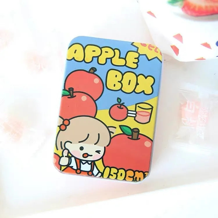 Small white iron storage box with a printed apple girl design on the lid.