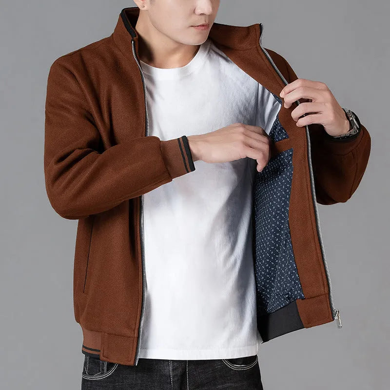 Men's grey sports fleece jacket with long sleeves and side pocket, shown on a hanger