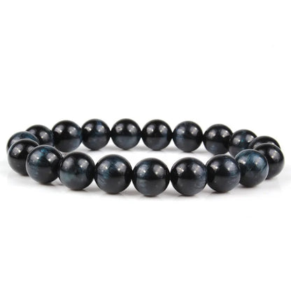 Natural tiger eye crystal bead bracelet showing round geometric beads on a wrist, available in multiple sizes and colour variations.