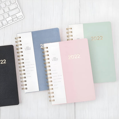 2022 week planner notebook with PU leather cover and coil binding, showing month grid pages