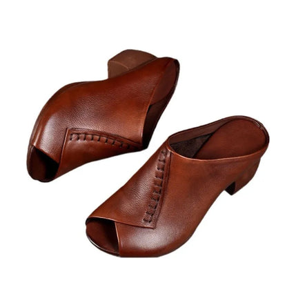 Women's black square heel peep-toe slippers with a rubber sole and fish mouth scaffold design.