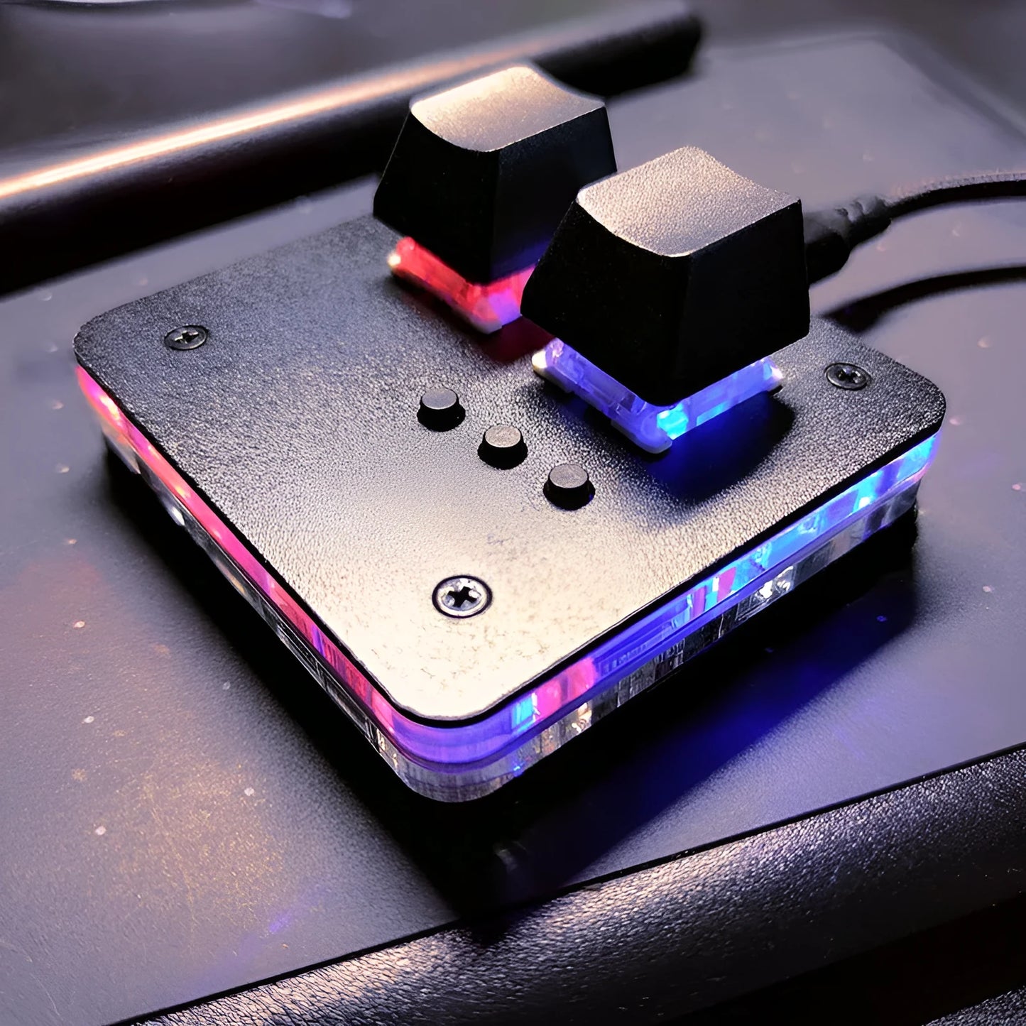 Mini USB wired keyboard in white, light grey, black, or pink colour on a desk.