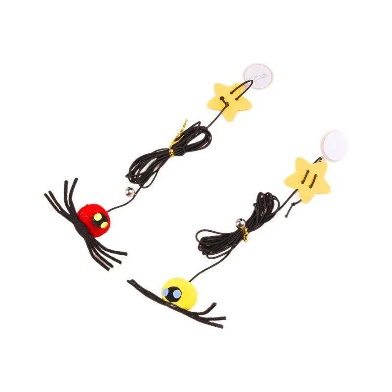 Red hanging door cat toy with elastic rope, feathers and spider-shaped bell mounted on door frame