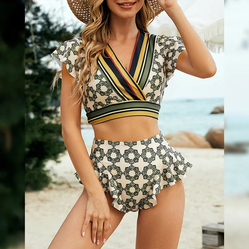 Green flounced backless bikini swimsuit with lace-up V-neck detail and matching shorts