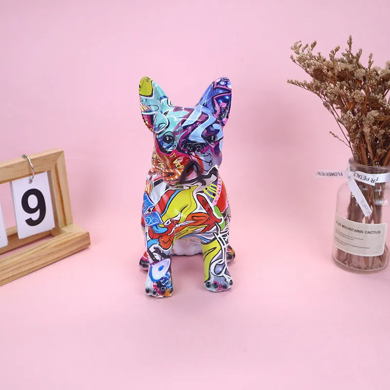 Colourful graffiti-style French bulldog resin statue on a white background