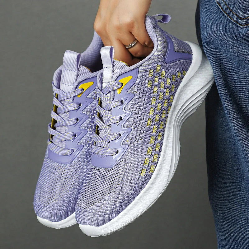 Women's running shoes made with Flyknit mesh upper in lavender purple or sapphire blue, available in sizes 35 to 46 with a wedge heel shape and round toe design for jogging and long-distance sports.