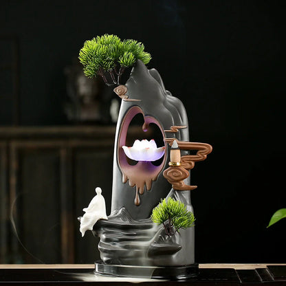 Purple clay tea pet ornament with downward flowing incense smoke and warm LED illumination