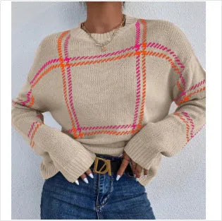 Women's loose-fitting plaid crew neck sweater with apricot, black, beige, red, and green colour-block stripes.