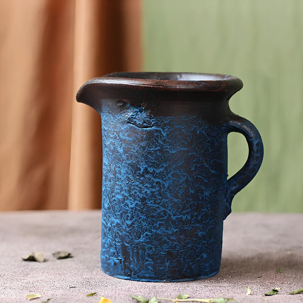 Ceramic mosaic vase with dried flower arrangement, handcrafted surface detailing