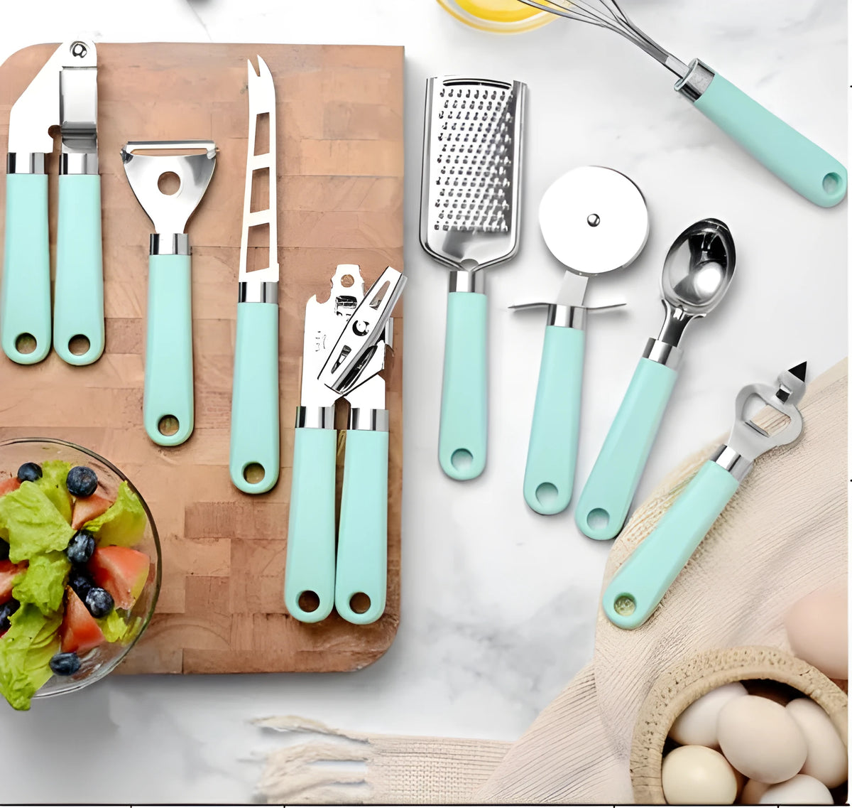 Nine-piece kitchen utensil set with stainless steel heads and plastic handles in four colour variations