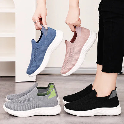 Women's Flyknit casual running shoes with soft PVC sole in black, grey, pink, and blue colour options.