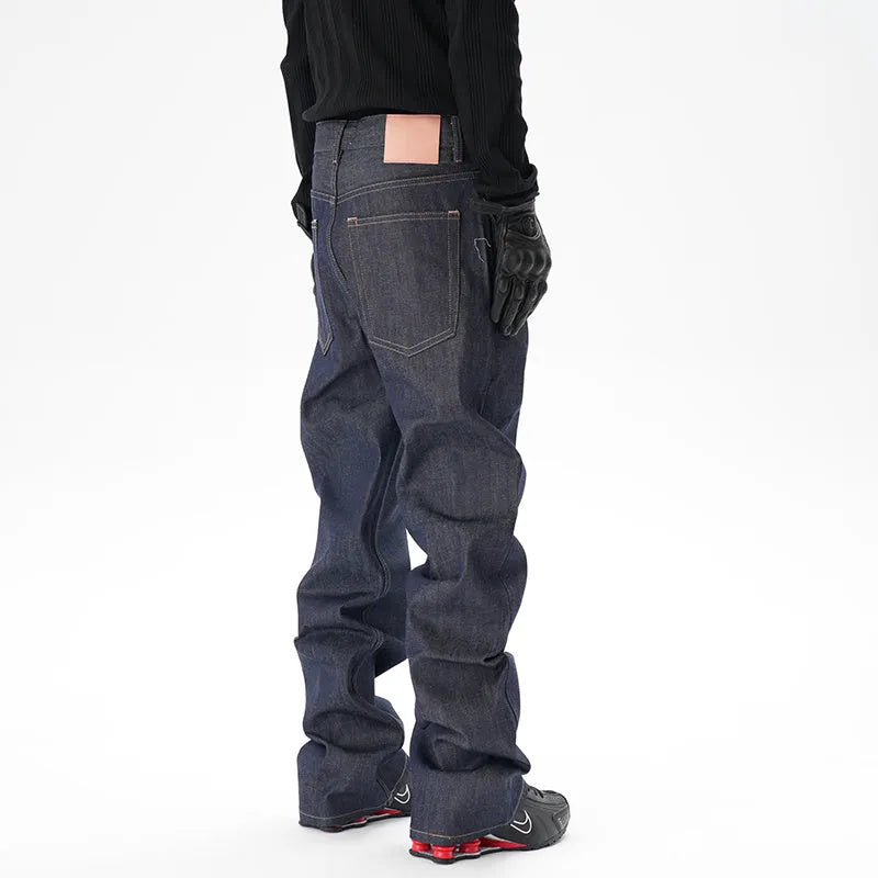 Men's dark blue loose straight-leg denim jeans laid flat, showing front view.
