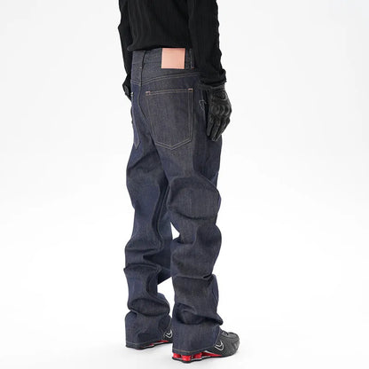 Men's dark blue loose straight-leg denim jeans laid flat, showing front view.