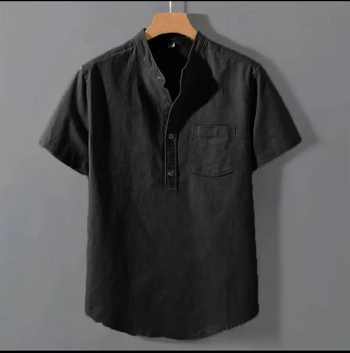 Men's casual beige linen-cotton shirt with stand collar and short sleeves on a hanger