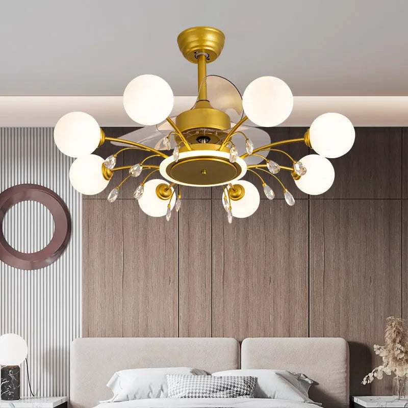 Black and gold ceiling fan lamp with acrylic shade and metal blades, shown with remote control.