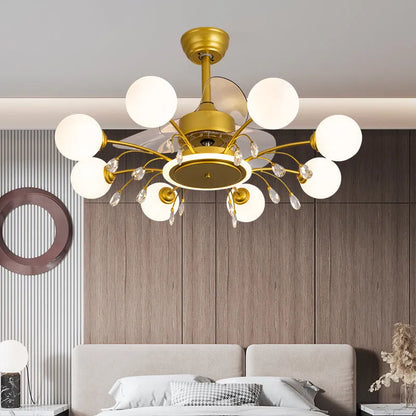 Black and gold ceiling fan lamp with acrylic shade and metal blades, shown with remote control.