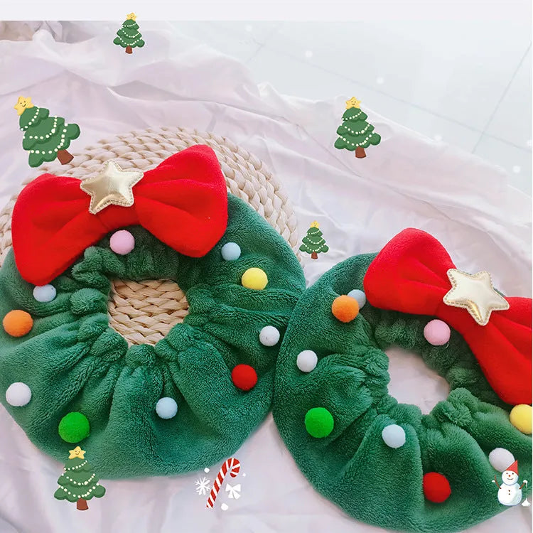 Red bow-knot Christmas pet scarf with colourful fuzzy balls on a dog, showing floral pattern and adjustable fit.